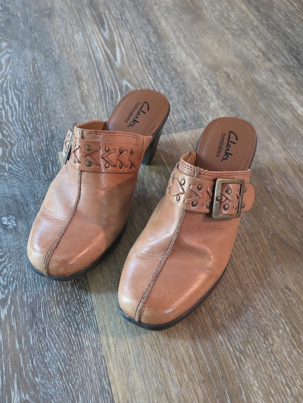 Clarks Women's Leather Buckle Mules in Cognac